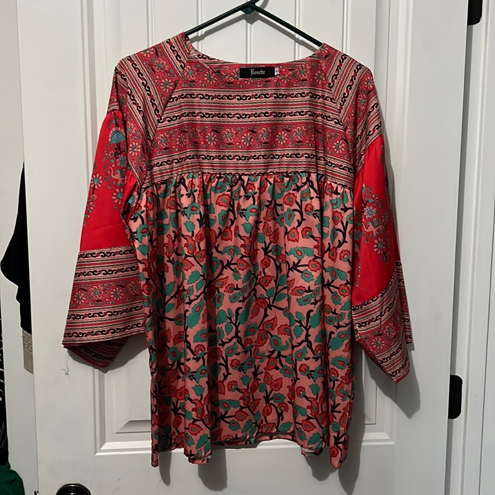 Selling this “Altered State” blouse. Brand on tag is “Roderick”. Size L/XL